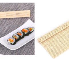 Bambusmatt sushi tegemiseks ning kõrval on taldrikul valmis sushi.