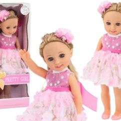 Ilus suur nukk heledate juuste ja uhke roosa pitsi ja lillevahuse kleidiga.