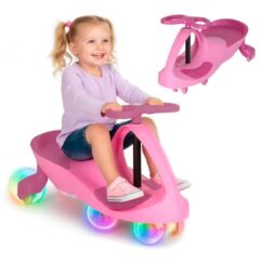 Roosa gravitatsioonisõiduk helendavate led ratastega, kus peal istub väike kahe patsiga tüdruk.